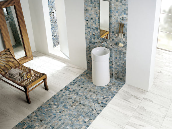 Blue colored penny tiled bathroom with white tile flooring.