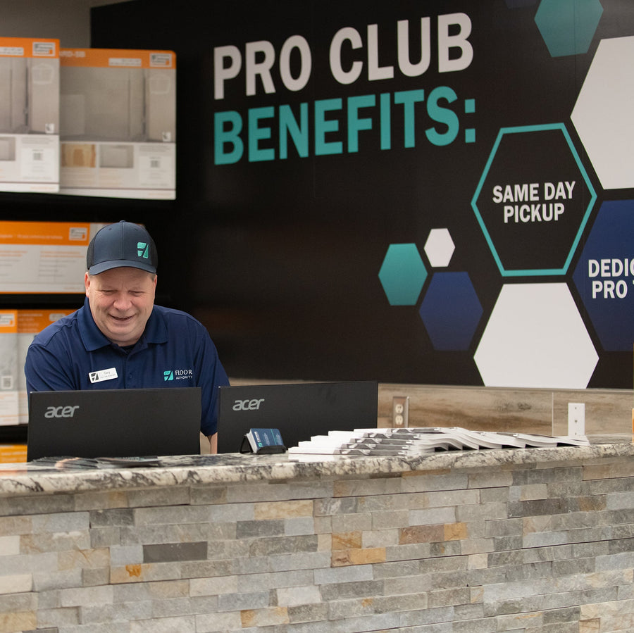 Floor Authority Pro Club with Man behind Counter