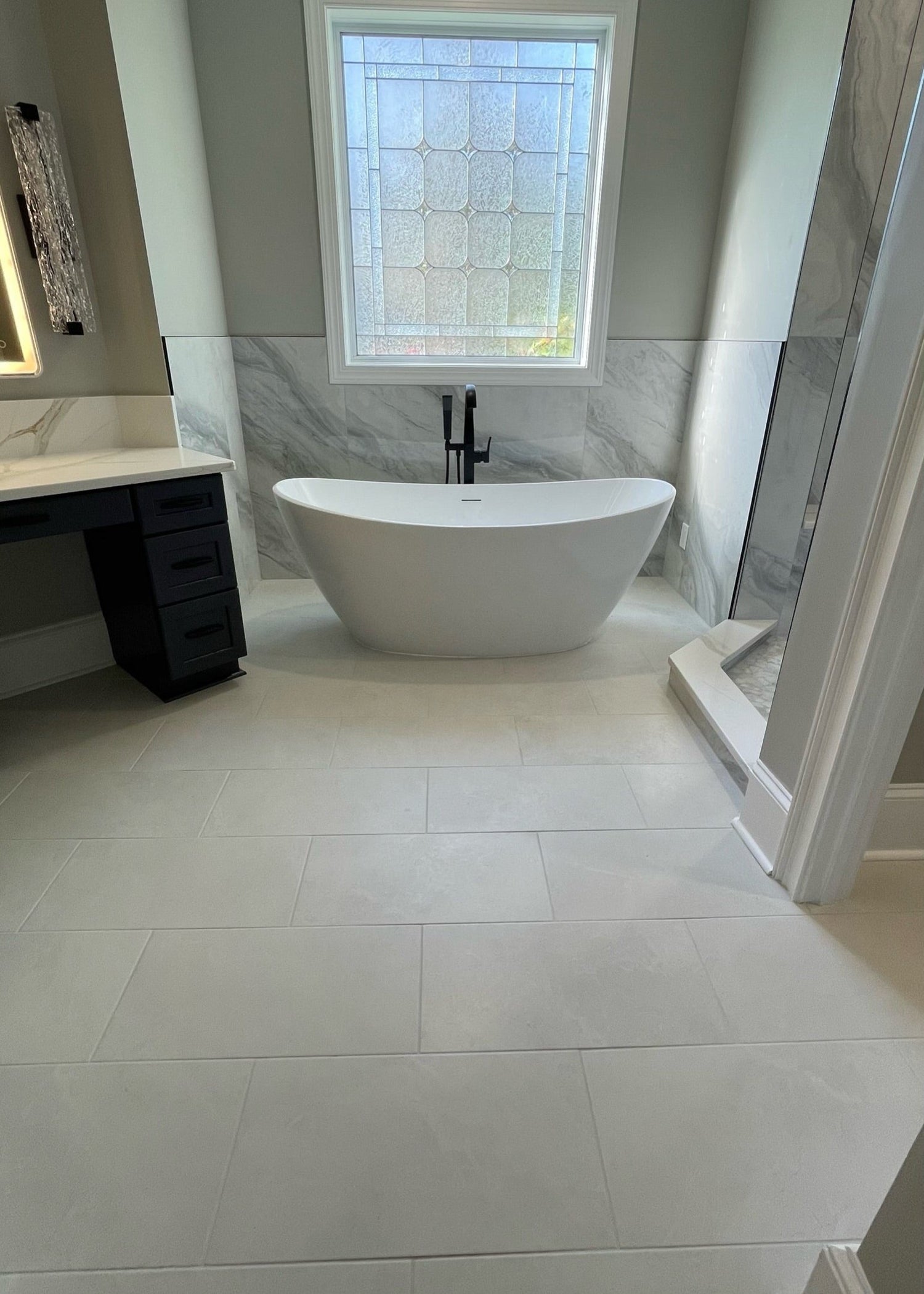 a bathroom installer with a stand alone tub