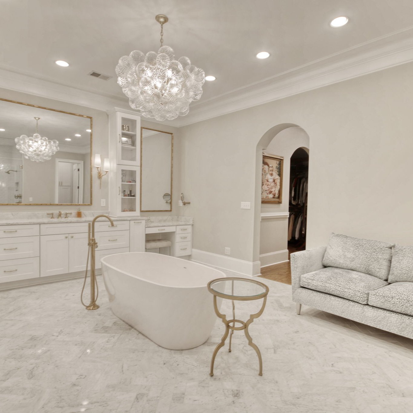a bathroom scene with a tub in the center of the room with tile flooring