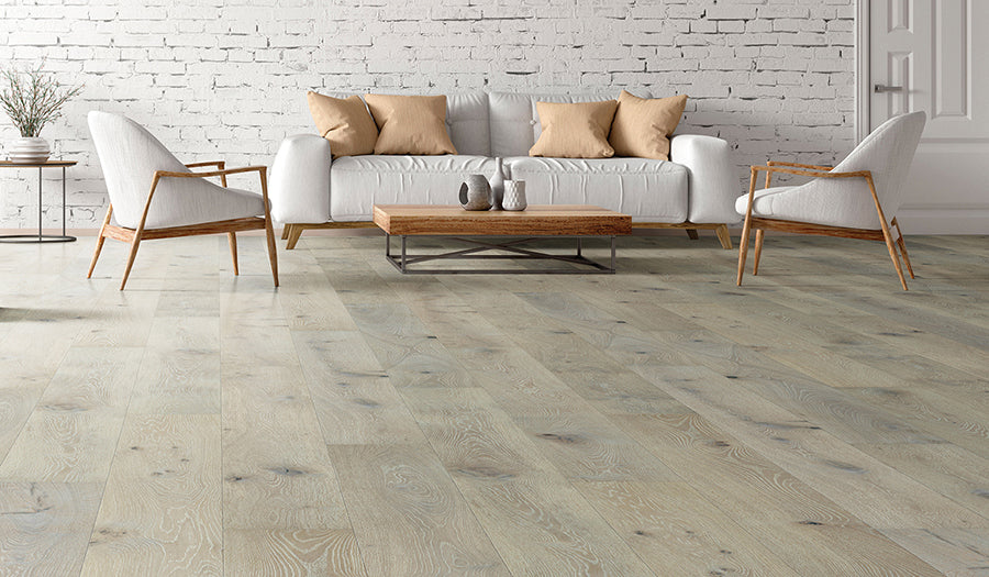 This is a room scene of living room with white furniture and natural wood coffee table. This is palladio hardwood floor in the color beach