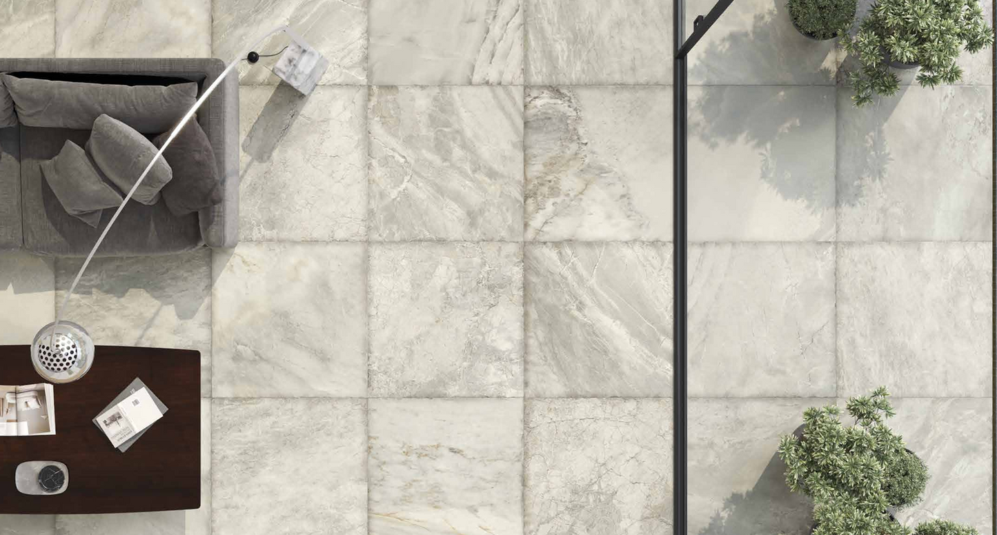 This is a aerial view of a living room with marmi imperial tile flooring