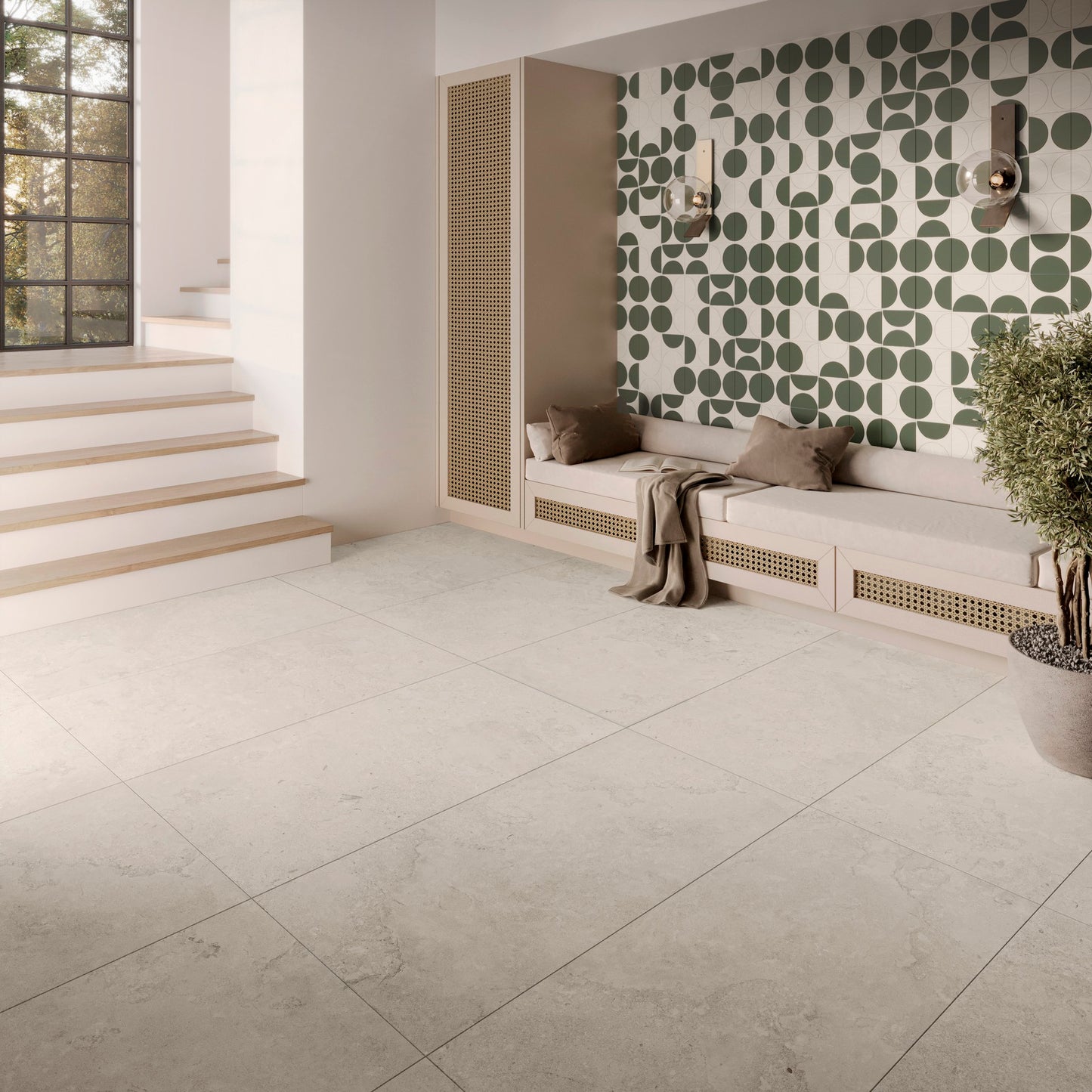 This is a living room room scene with a green and white pattern accent wall. The tile floor is Norian in the color ivory