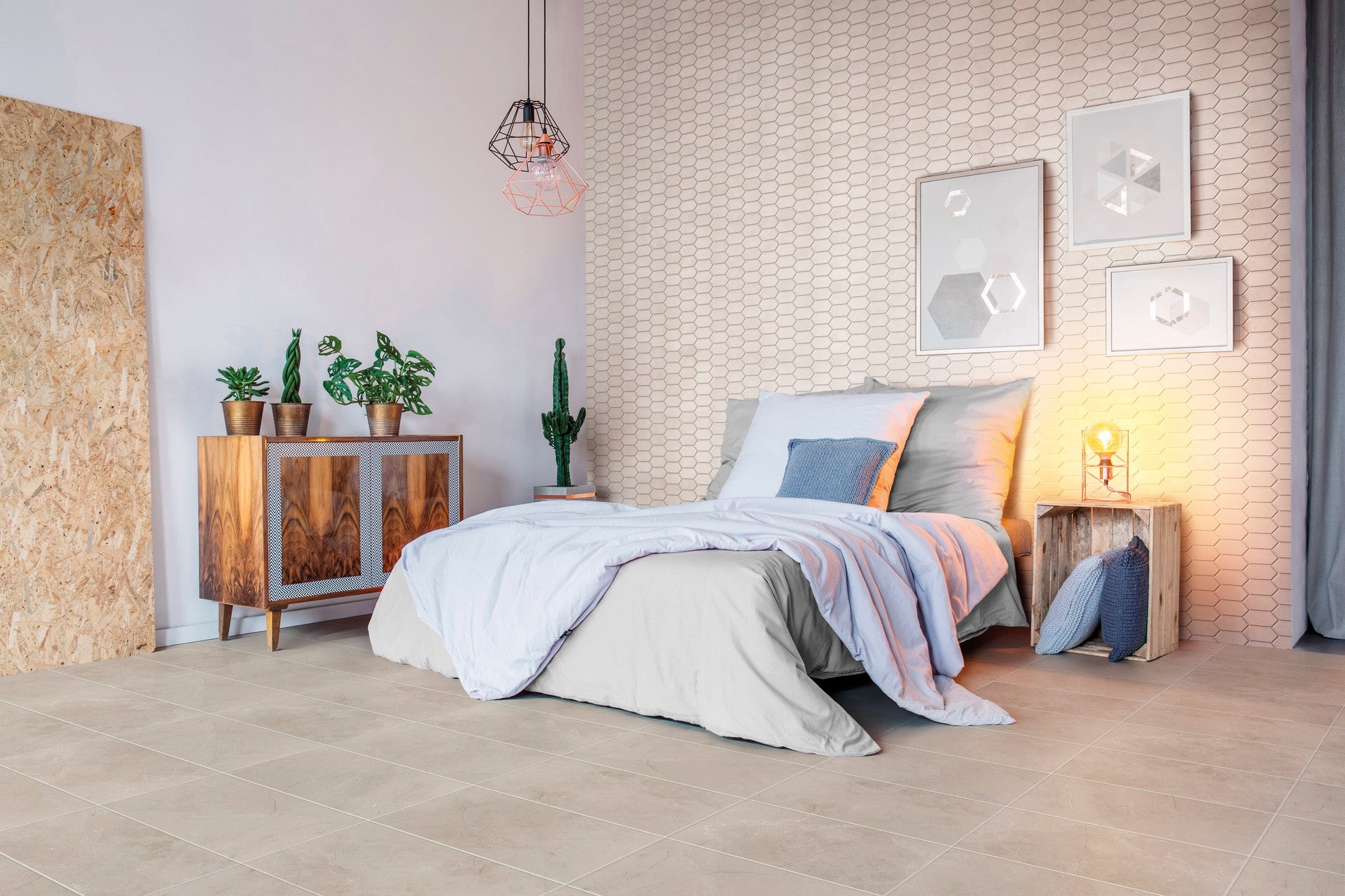 This is a room scene of a bedroom with the tile floor being st croix in the color caramel. The accent wall is st croix picket in the color bianco