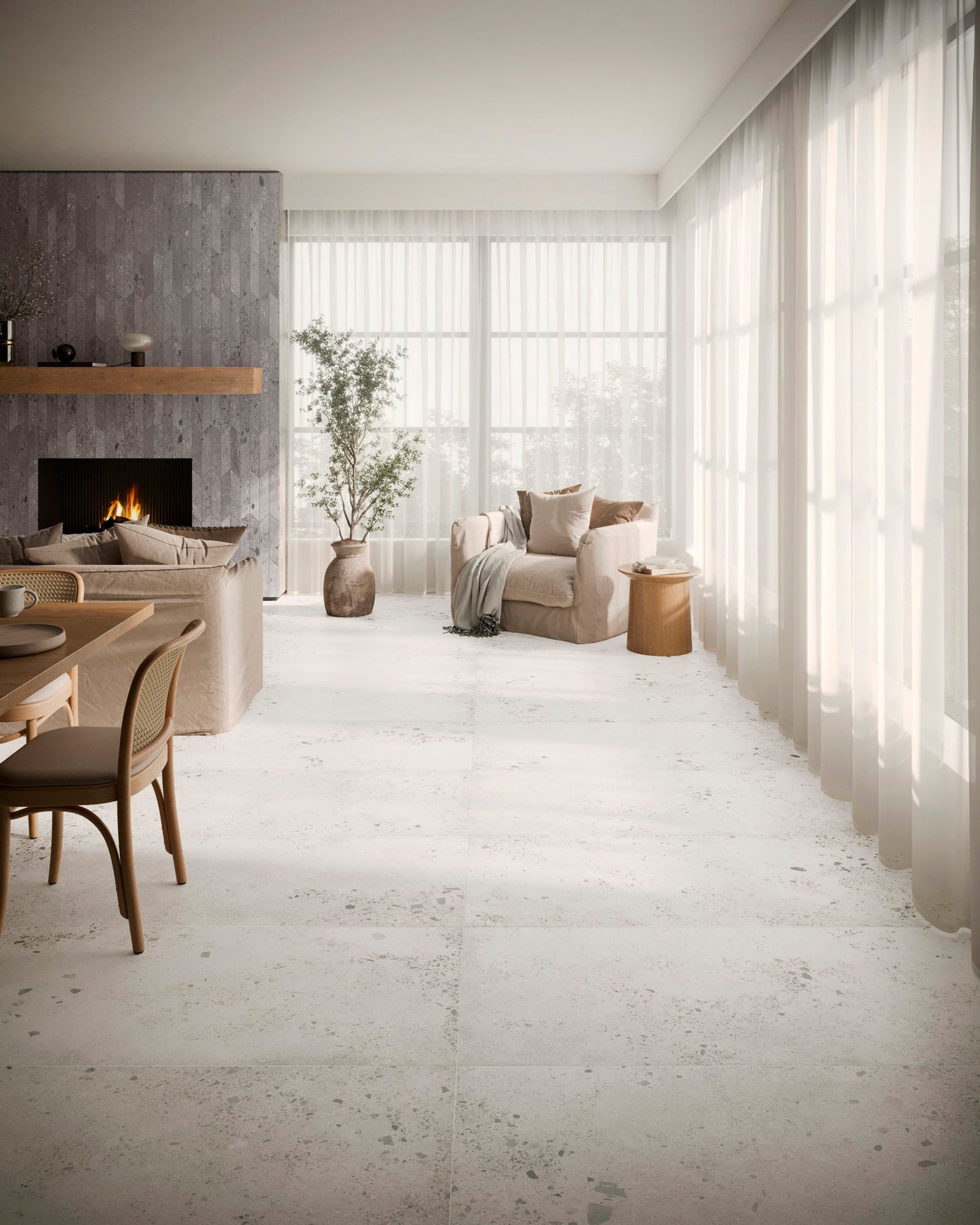 This is a room scene with the tile lab. This is a living room/dining room with a tiled fireplace and tile floors