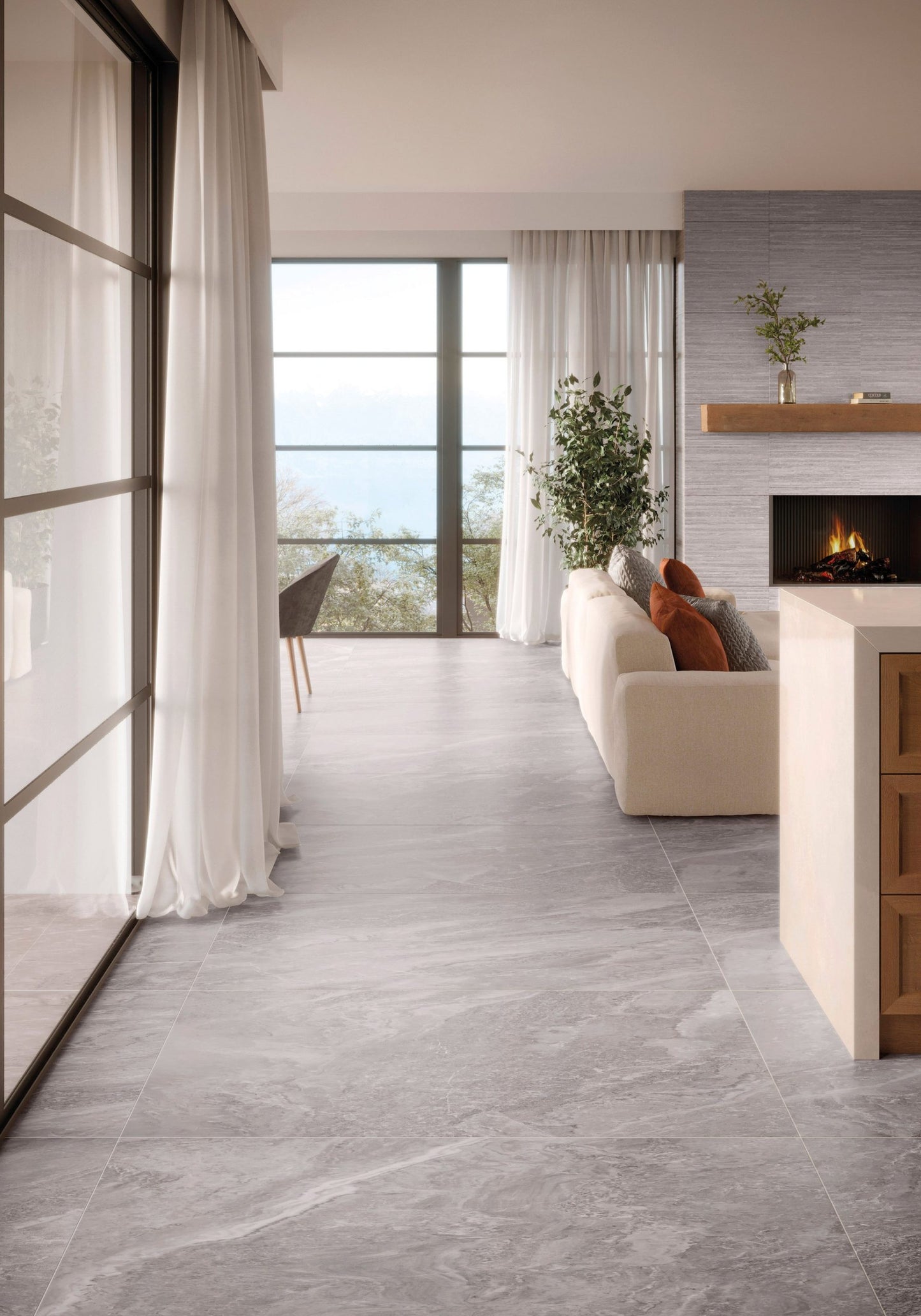 This is a room scene of a living room with a fire place and the tile floor is storm in the color grey
