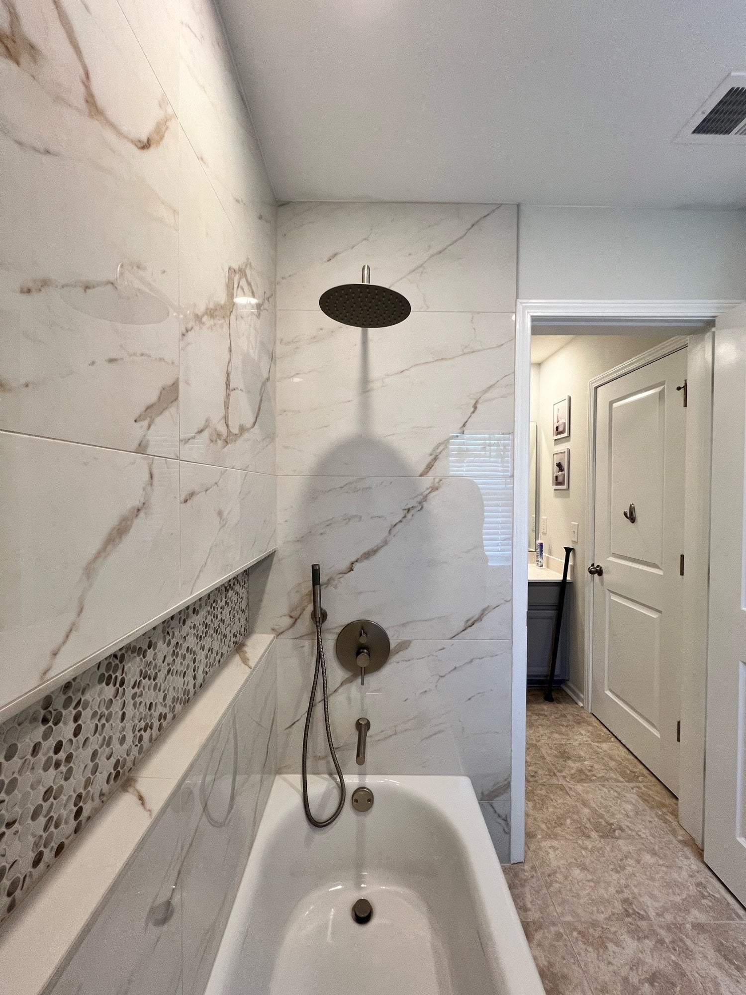 marble tile shower with penny round niche
