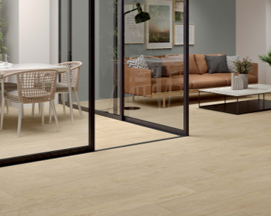 This is a room scene of an office with a brown leather couch and tymber roble wood looking tile