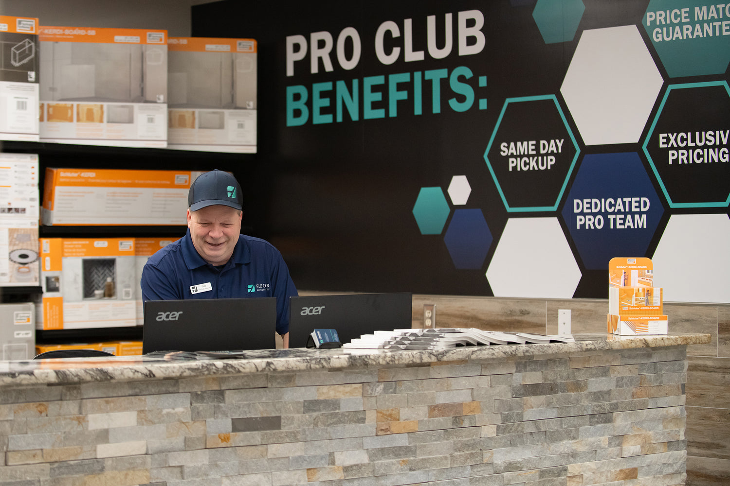 Floor Authority Pro Club with Man behind Counter