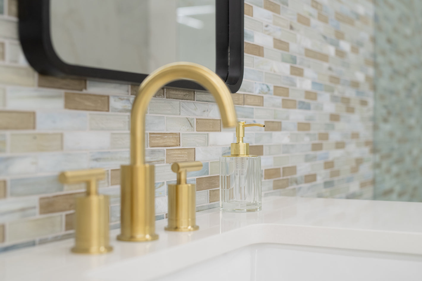 an up-close image of sink with tommy bahama backsplash