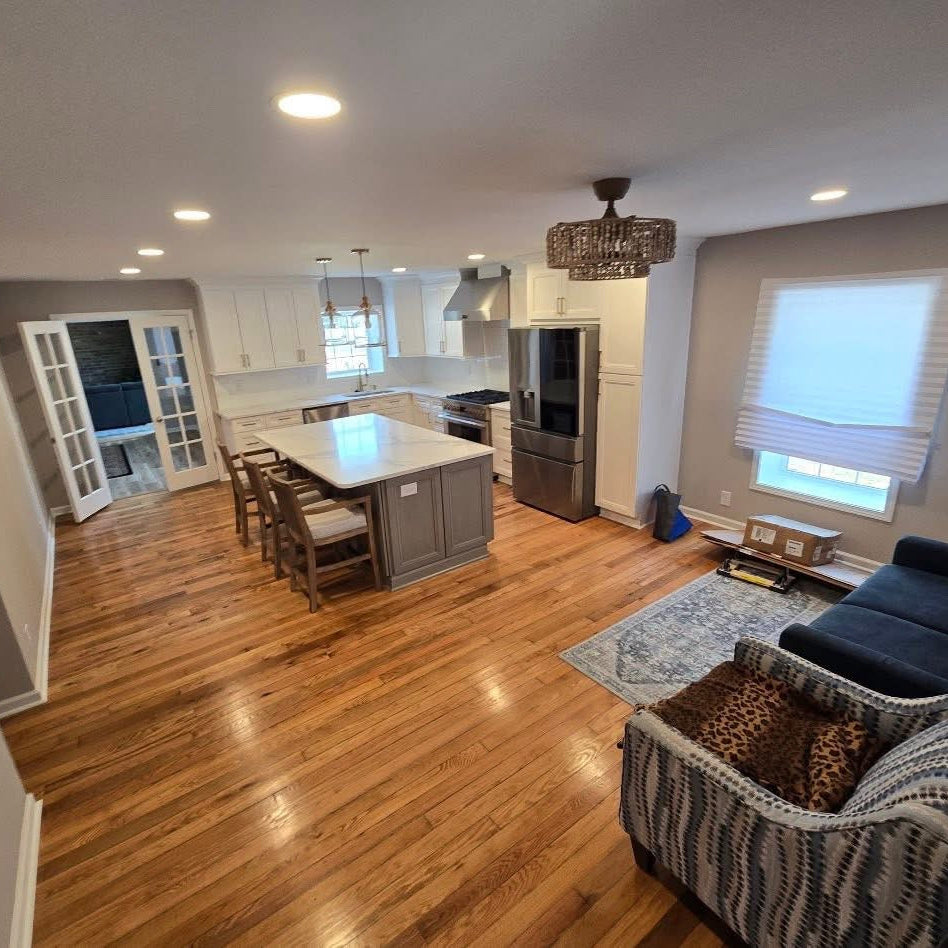 Living room with a view of a kitchen in a home interior
