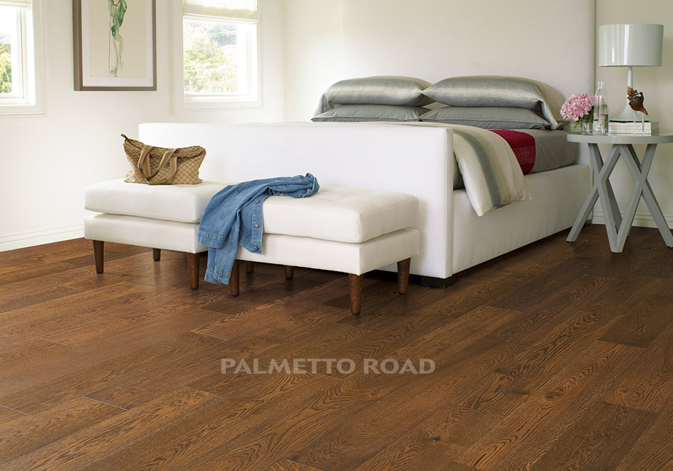 This is a room scene of a bedroom with the hardwood flooring monet in the color bordeaux