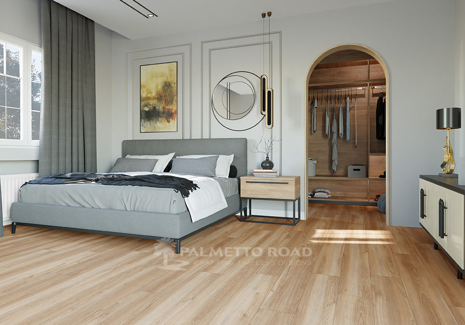 This is a room scene of a bedroom with laminate flooring called trailblazer. The bedroom furniture is gray with light colored wood furniture to match.