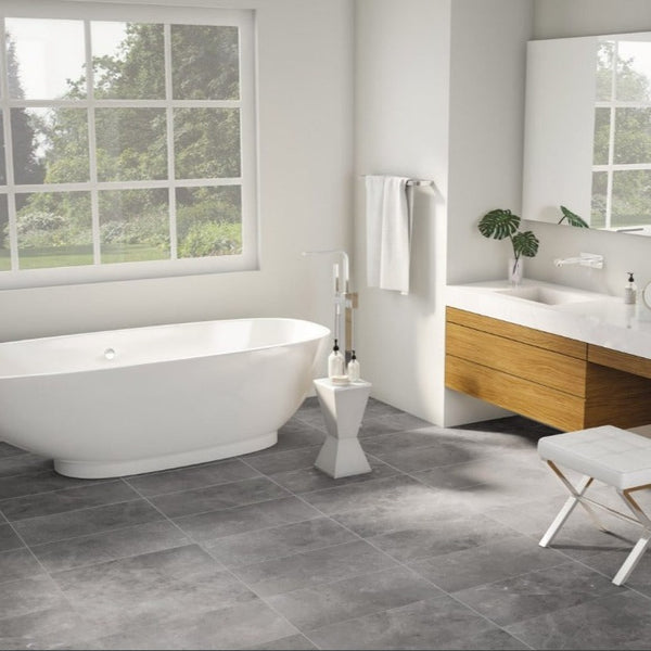 st croix 12x24 ash bathroom tile with a white tub