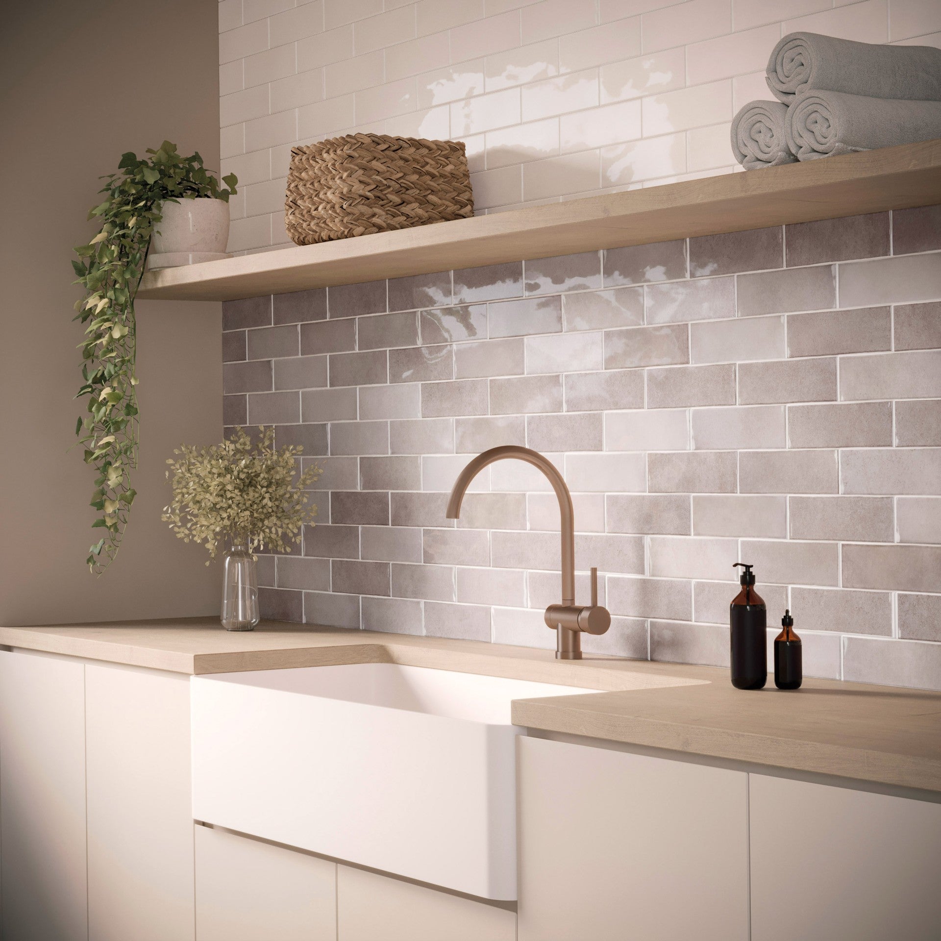 This picture shows a bathroom with ceramic subway tiles. The tiles are a light blue color, which makes the room look serene and elegant. The tiles are arranged in a herringbone pattern, which adds visual interest to the room.