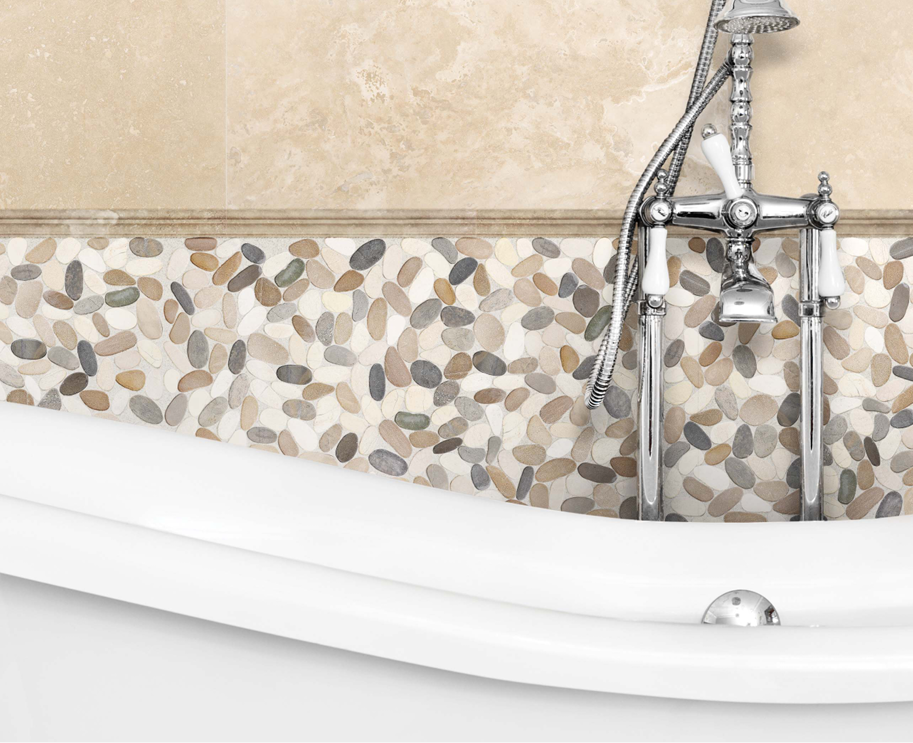 island flat pebbles in the color harmony in a bath tub surround