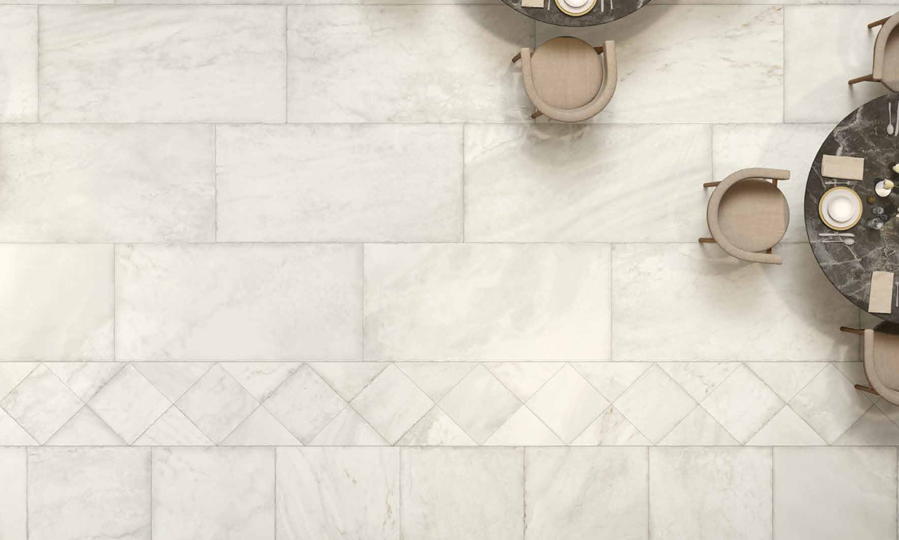 This is an aerial view of a dining area with the  tile marmi imperial in the color aurelia