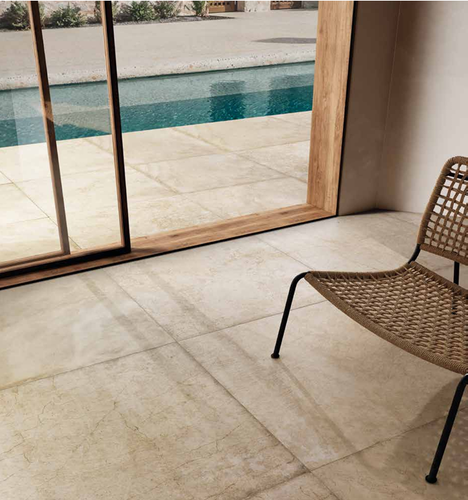 This is a room scene of a living room extending to an outdoor patio area. 