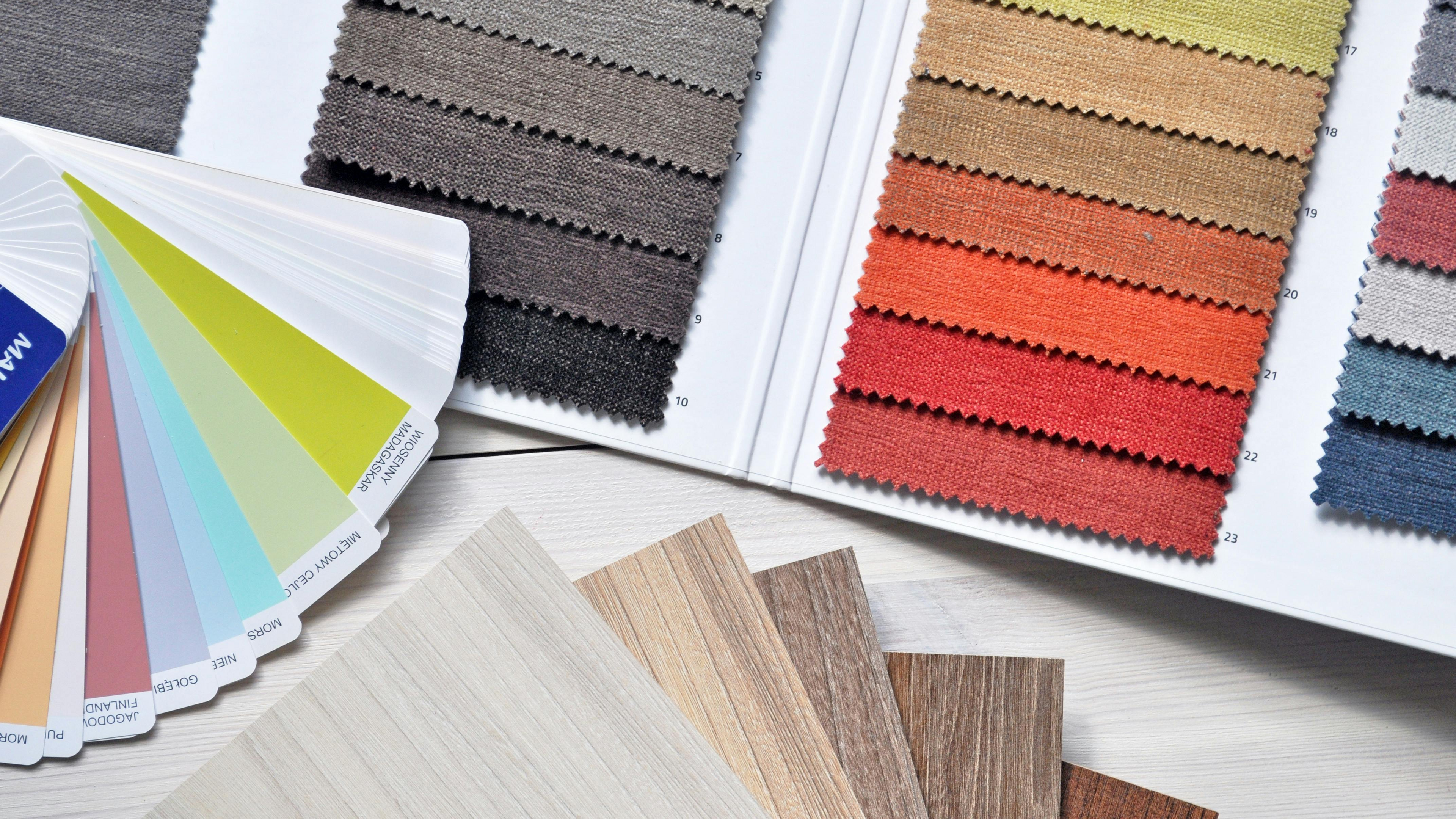 Interior design moodboard with fabrics, paint colors, and flooring samples