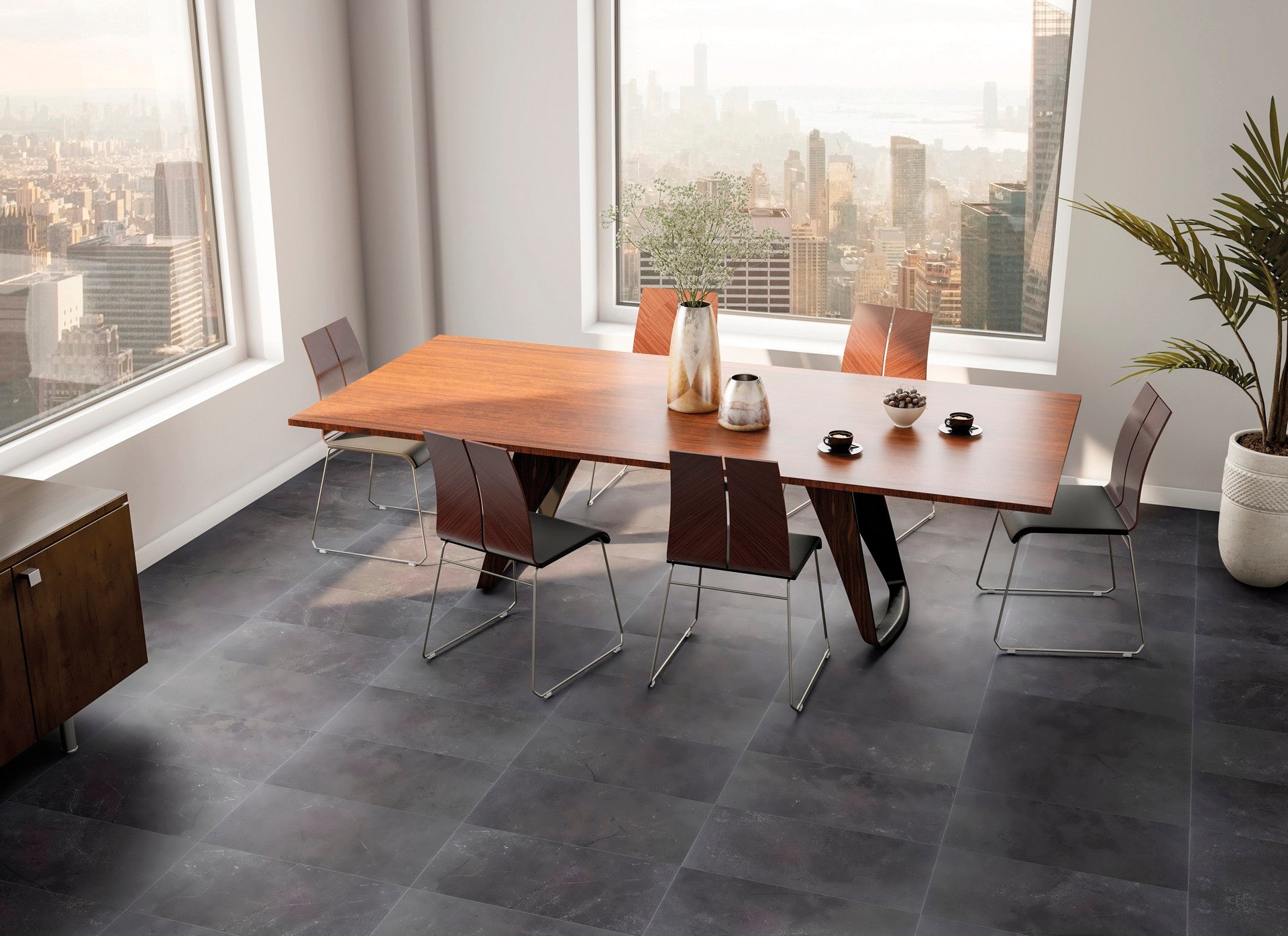 This is a room scene of a dining room with a wooden table and chairs. The floor tile is st croix in the color flint