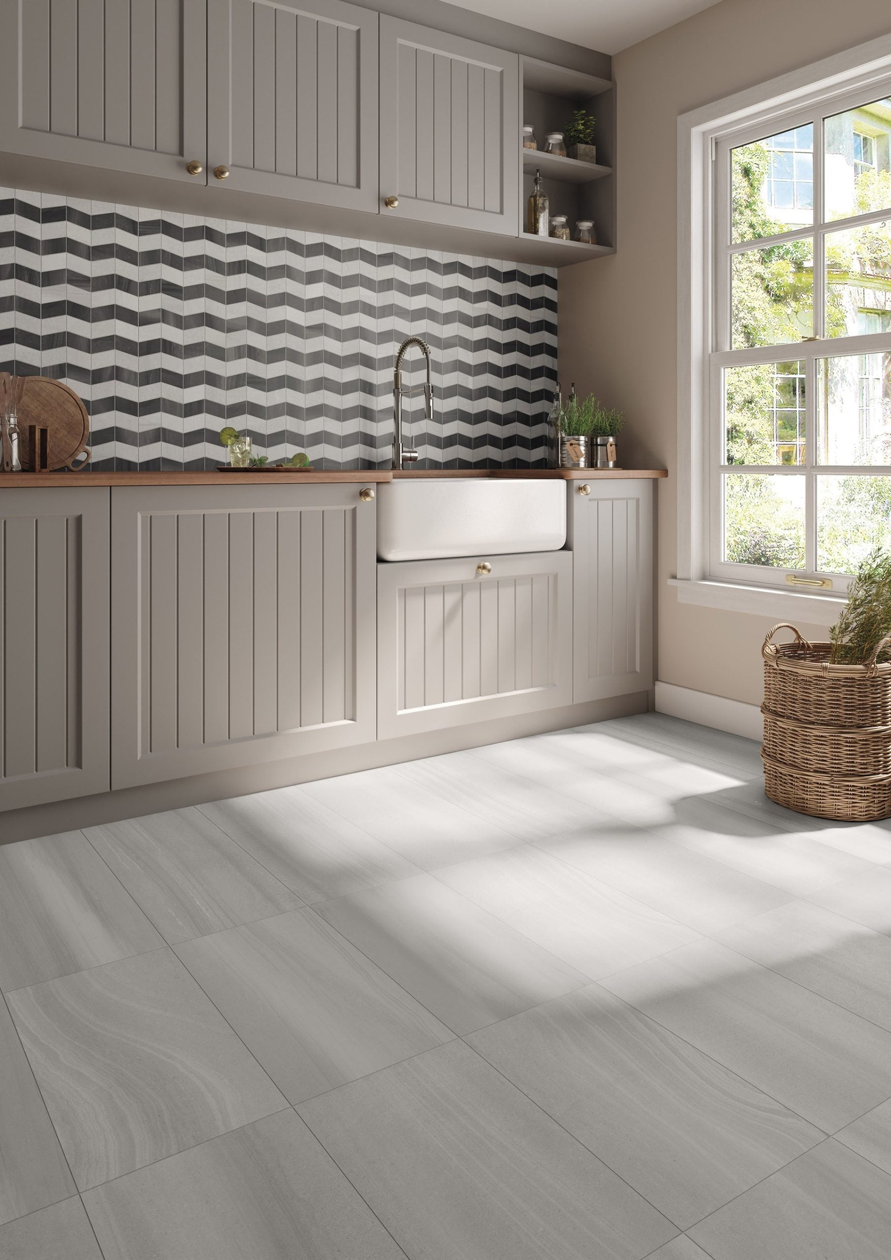 This is a room scene of a laundry room with the tile floor being sandwaves in the color light.