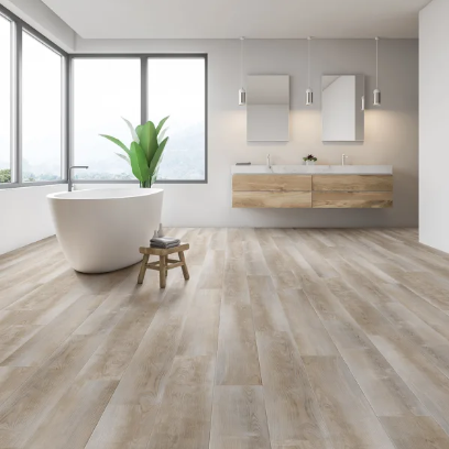 genesis vinyl plank in the color sugar pine in a bathroom setting with a free floating tub