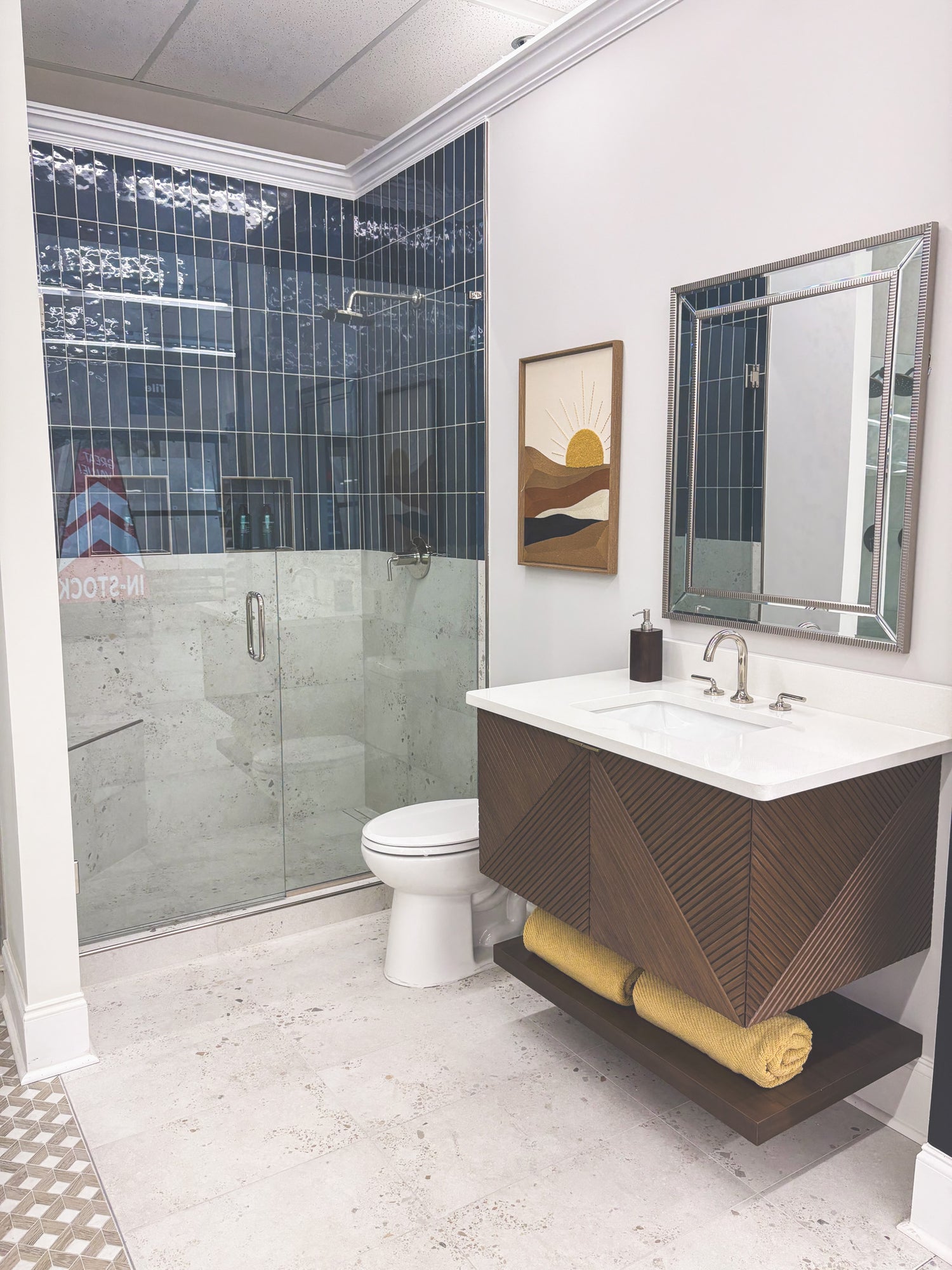 bathroom vignette with blue subway tile and lab tile